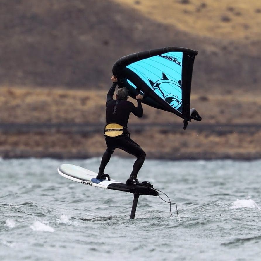 Tony Logosz carving on the foil under a Slingwing, November 2015